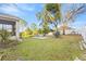 Spacious backyard with patio and mature trees at 935 Don Wilson Ave, Apopka, FL 32712