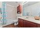 Clean bathroom with tub, shower, and updated vanity at 935 Don Wilson Ave, Apopka, FL 32712