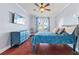 Bright bedroom featuring hardwood floors and a ceiling fan at 935 Don Wilson Ave, Apopka, FL 32712