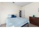 Simple bedroom with a double bed and dresser at 935 Don Wilson Ave, Apopka, FL 32712