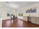 Bright dining room with hardwood floors and built-in desk at 935 Don Wilson Ave, Apopka, FL 32712