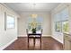 Bright dining room with hardwood floors and large windows at 935 Don Wilson Ave, Apopka, FL 32712