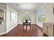 Bright dining room with hardwood floors and large windows at 935 Don Wilson Ave, Apopka, FL 32712
