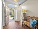 Bright entryway with tile flooring, bench, and access to backyard at 935 Don Wilson Ave, Apopka, FL 32712