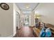 Bright entryway with tile flooring, bench, and access to backyard at 935 Don Wilson Ave, Apopka, FL 32712
