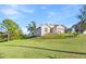 Landscaped yard and house from a side view at 935 Don Wilson Ave, Apopka, FL 32712