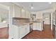 Modern kitchen with granite countertops and stainless steel appliances at 935 Don Wilson Ave, Apopka, FL 32712
