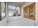 Enjoy the outdoors in this spacious screened porch with double doors at 935 Don Wilson Ave, Apopka, FL 32712