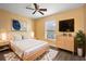 Main bedroom with a queen bed and light wood furniture at 95 Fort Smith Blvd, Deltona, FL 32738