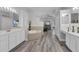 Spa-like bathroom with double vanities and a large tub at 11013 Creighton Dr, Orlando, FL 32817