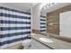 Nautical-themed bathroom with wood-look walls at 11013 Creighton Dr, Orlando, FL 32817