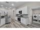 Modern kitchen with stainless steel appliances and white cabinets at 11013 Creighton Dr, Orlando, FL 32817