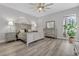 Main bedroom with king-size bed, dresser and large window at 11013 Creighton Dr, Orlando, FL 32817