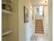 Bright entryway with built-in shelving and staircase at 1102 Victoria Glen Dr, Sanford, FL 32773