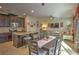 Open concept kitchen and dining area with granite countertops and stainless steel appliances at 1102 Victoria Glen Dr, Sanford, FL 32773