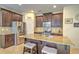 Kitchen with dark brown cabinets, granite countertops and stainless steel appliances at 1102 Victoria Glen Dr, Sanford, FL 32773