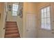 Wooden staircase with tile flooring and framed pictures on wall at 1102 Victoria Glen Dr, Sanford, FL 32773