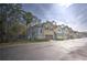 Row of townhouses with attached garages and landscaping at 1102 Victoria Glen Dr, Sanford, FL 32773