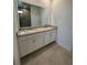 Elegant bathroom with double vanity and granite countertop at 1141 Lakeshore Breeze Pl, Kissimmee, FL 34747