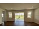 Living area with sliding doors leading to the backyard at 1141 Lakeshore Breeze Pl, Kissimmee, FL 34747