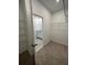 Spacious walk-in closet with shelving and attached bathroom at 1141 Lakeshore Breeze Pl, Kissimmee, FL 34747