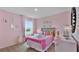 Charming bedroom with Disney theme and built in shelving at 1218 Limbali St, Mount Dora, FL 32757