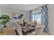 Bright dining room with a large window and patterned curtains at 1218 Limbali St, Mount Dora, FL 32757