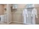 Bright laundry room with washer, dryer, and ample storage at 1218 Teal Creek Dr, St Cloud, FL 34771