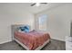 Cozy bedroom with a queen-size bed and window at 14031 Willow Grace, Orlando, FL 32824