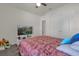 Spacious bedroom with a queen-size bed and TV at 14031 Willow Grace, Orlando, FL 32824