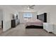 Spacious main bedroom with large bed, dresser, and ceiling fan at 14031 Willow Grace, Orlando, FL 32824