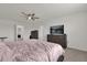 Main bedroom with king bed, dresser, and access to other rooms at 14031 Willow Grace, Orlando, FL 32824