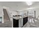 Kitchen with island and dark brown cabinets at 14031 Willow Grace, Orlando, FL 32824