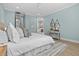 Serene main bedroom with a king-size bed and ensuite bathroom access at 1406 Saxon Dr, New Smyrna Beach, FL 32169