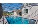 Inviting screened pool and patio with comfortable seating at 1406 Saxon Dr, New Smyrna Beach, FL 32169