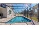 Screened pool and patio with ample space for relaxation at 1406 Saxon Dr, New Smyrna Beach, FL 32169