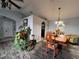 Dining area with a wooden table, chairs, and wood-look tile flooring at 15824 Marsh Elder St, Clermont, FL 34711