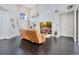 Living room with leather furniture, hardwood floors, and a fireplace at 1763 Stargazer Ter, Sanford, FL 32771