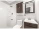 Updated bathroom with white subway tile and dark vanity at 1937 Eland Ave, Winter Park, FL 32789