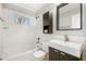 Clean bathroom with white subway tiles, modern vanity, and bathtub at 1937 Eland Ave, Winter Park, FL 32789