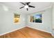 Light and airy bedroom with hardwood floors and large windows at 1937 Eland Ave, Winter Park, FL 32789