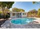 Inviting kidney-shaped pool surrounded by a gray paver patio at 1937 Eland Ave, Winter Park, FL 32789