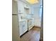 Bright kitchen with white cabinets and wood-look floors at 211 W San Sebastian Ct, Altamonte Springs, FL 32714