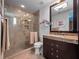 Modern bathroom with glass shower, granite vanity, and ample storage at 2224 Alaqua Dr, Longwood, FL 32779