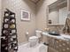 Stylish powder room with a unique sink and decorative shelving at 2224 Alaqua Dr, Longwood, FL 32779