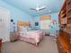 Charming bedroom with light blue walls and built-in desk at 2224 Alaqua Dr, Longwood, FL 32779