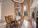 Bright dining room featuring a large table and elegant chandelier at 2224 Alaqua Dr, Longwood, FL 32779