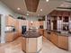 Modern kitchen with large island, granite countertops, and ample cabinetry at 2224 Alaqua Dr, Longwood, FL 32779