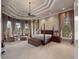 Luxurious main bedroom with ample natural light and sitting area at 2224 Alaqua Dr, Longwood, FL 32779