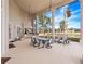 Outdoor kitchen and dining area with serene water views at 2224 Alaqua Dr, Longwood, FL 32779